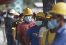 வெளிநாட்டு தொழிலாளர்களின் கோவிட் தொற்று செலவினை முதலாளிகள் ஏற்க வேண்டும்