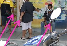 DUA LELAKI DAN SEORANG PEREMPUAN DENGAN BERGELANG MERAH JAMBU DI DEPAN FARMASI PUCHONG