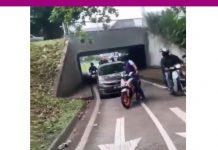 கூட்டரசு நெடுஞ்சாலையில் மோட்டார் சைக்கிள் பாதையில் கார் ஓட்டி சென்ற நபர்