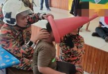 தலையில் கூம்பு சிக்கியதால் அவதியுற்ற தொடக்கப் பள்ளி மாணவர்