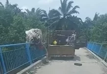 பாலத்தில் இருந்து குப்பையை வீசிய லோரி ஓட்டுநர் கைது