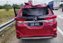 லோரியின் டயர் கார் மீது மோதியதில் ஓட்டுநர் காயம்