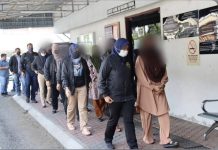 ஆவணமற்ற புலம்பெயர்ந்தோருக்கு MyKad ஐ வழங்கியதற்காக ஐந்து அமலாக்க அதிகாரிகள் உட்பட 9 பேர் கைது