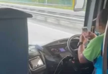 Polis saman pemandu bas tular guna telefon