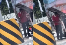 Lelaki merokok ketika isi minyak bas