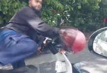 சிறிய சாலை விபத்தில் கார் கண்ணாடியை சேதப்படுத்திய மோட்டார் சைக்கிளோட்டி கைது