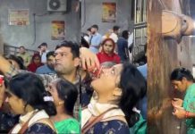 கோவில் ஏசி மெஷின் குழாயில் வந்த நீரை தீர்த்தம் என்று வரிசைகட்டி பிடித்துக் குடித்த பக்தர்கள்